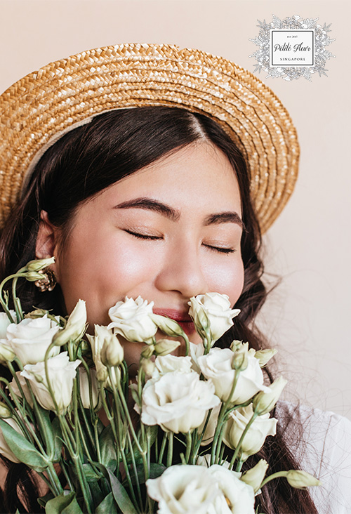 A Person Smelling Flowers